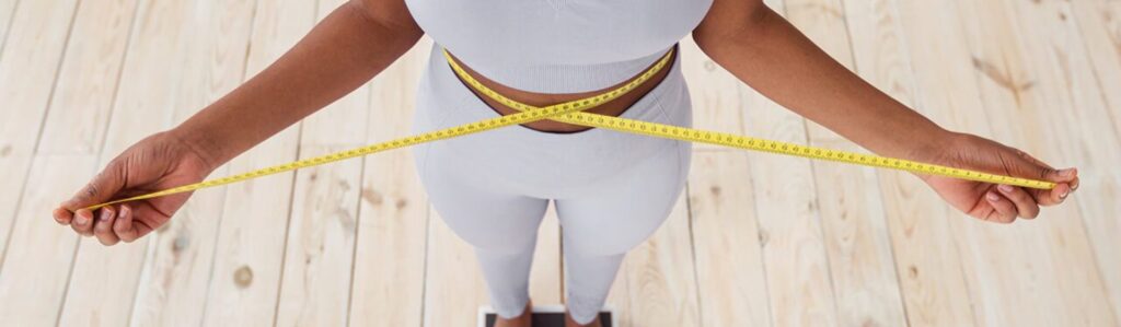 Waist measured with a tape measure while standing on a scale during a GLP-1 weight loss plateau.