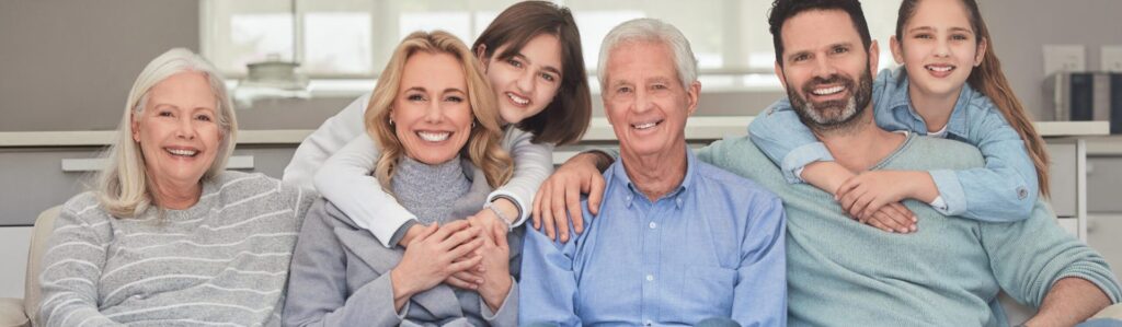 Smiling multigenerational family relaxing together at home, reflecting supportive GLP-1 weight loss care.